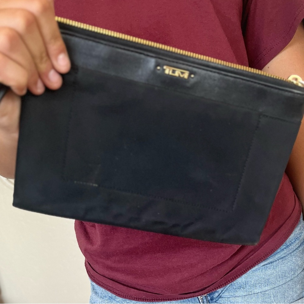 Black Tumi clutch purse.